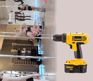 a drill powering the rotation of a pole used for pole dancing